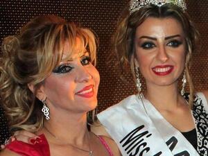 Nadine Fahad (R) is crowned queen.