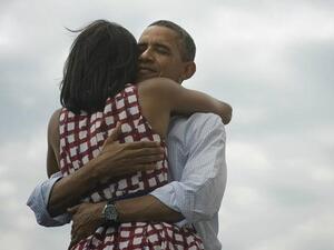 President Obama hugs his wife Michelle 