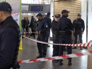 Police officers gather at the site of the stabbing, in Paris. AFP Image. 