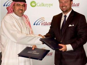 Ibrahim Mohamed Lari, Managing Director of Injazat and Matthew Cochran, President of Cellcrypt shaking hands after the signing