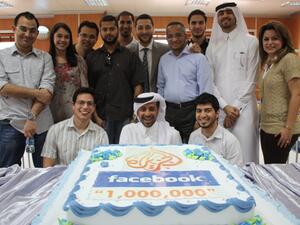 Al Jazeera's social media team celebrating with a specially branded cake