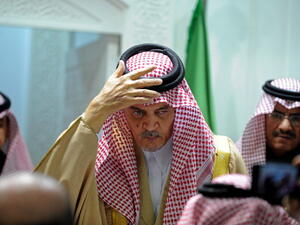 Saudi Foreign Minister Prince Saud al Faisal as he adjusts his keffiyeh (FAYEZ NURELDINE/AFP/Getty Images)