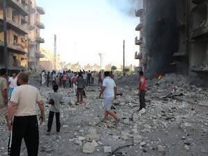 Rubble and debris litter the street following an explosion in the northern Syrian city of Raqqa, early on August 7, 2013. (AFP)