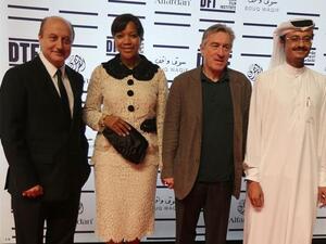 US actor Robert De Niro (2nd L) founder of New York's Tribeca Film Festival, poses for a photograph along side his wife Grace Hightower De Niro and Indian actor Anupam Kher (L) and Doha Film Institute CEO Abdulaziz Bin Khalid Al-Khater (R) at the Doha Tribeca Film Festival in the Qatari capital. AFP