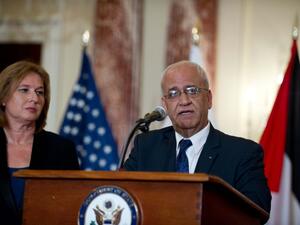 Chief Palestinian negotiator Saeb Erakat speaks to the press with Israel's chief negotiator and Justice Minister Tzipi Livni at the State Department in Washington DC on July 30, 2013. (AFP)