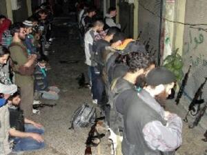 Rebel fighters pray in Syria's central city of Homs on June 17. (AFP/Shaams)