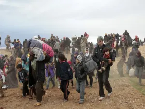 Thousands of Syrians have fled the town of Kobani due to ongoing violence. (AFP/File)