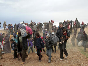 Thousands of Syrians have fled the town of Kobani due to ongoing violence. (AFP/File)
