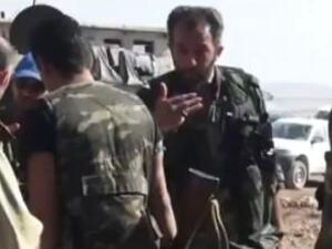 A screenshot of an Iranian military adviser talking to Syrian army troops (Al Bawaba/YouTube)
