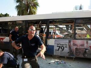 Israeli police gather after a blast ripped through a bus near the defence ministry in Tel Aviv on November 21, 2012. AFP PHOTO / DANIEL BAR-ON
