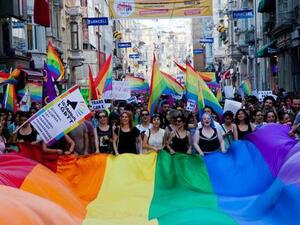 Can Cavusoglu is running to be mayor in a Turkish town, making him the first openly gay person to stand for office. Gay and human rights activists march during anti-government protests on Istiklal Street, the main shopping corridor on June 23, 2013 in Istanbul. (AFP)