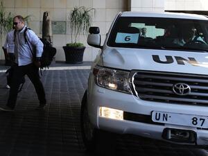 The UN chemical weapons investigation team arrives in Damascus on August 18, 2013. (AFP)