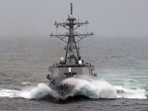 Waves crash over the bow of the Arleigh-Burke-class guided missile destroyer USS Barry, one of those deployed to the Mediterranean in anticipation of a military strike on Syria. (AFP)