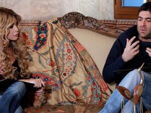 Nawal al Zoghbi and Wael cosy up on the couch. 