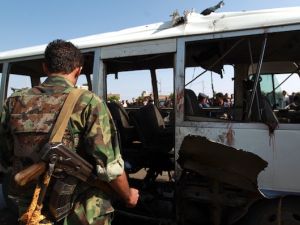 emeni security forces inspect a damaged military bus following a bomb blast in Sanaa on August 25, 2013.(AFP)