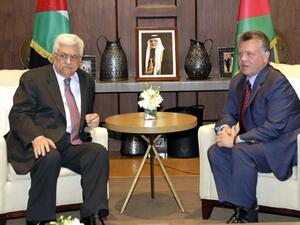 Jordan’s King Abdullah II (R) and Palestinian President Mahmoud Abbas (R) signed an agreement confirming their “common goal to defending” Jerusalem. (AFP)