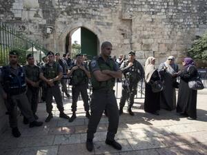 Israeli border guards stand guard outside the al-Aqsa mosque on Tuesday. (Photo: AFP / AHMAD GHARABLI)