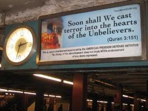 The ads show a burning World Trade Center with a quote attributed to the Quran.