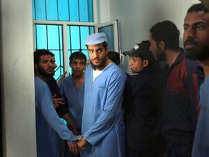 Suspects from al-Qaeda wait for their trial Sunday in Sanaa (Mohammed Huwais/AFP)