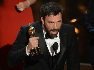 Argo director Ben Affleck accepts the Oscar for Best Movie at the 85th Annual Academy Awards (Photo: AFP / Robyn Beck)