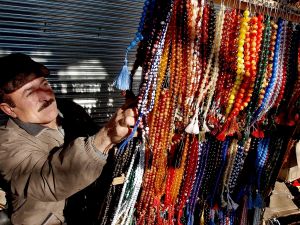 Faris Al Faris with the giant rosary that took him 18 months to complete. He has carved on the beads the 99 names of Allah, all the prophets’ names as well as the Shahada.