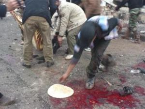 اثار الدماء في موقع غارة جوية سورية على مخبز في بلدة حلفايا قرب حماة