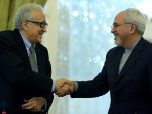 UN envoy Lakhdar Brahimi told reporters in Iran following his meeting with Iran's Foreign Minister Javad Zarif that Tehran's participation in the proposed Geneva talks is "necessary" (AFP) 