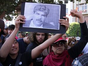 Demonstrators hold a picture of slain opposition figure Mohamed Brahmi on July 25 in Tunis (AFP / Khalil)