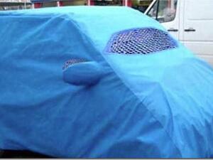 A car cover that looks like an Afghani burkah. 