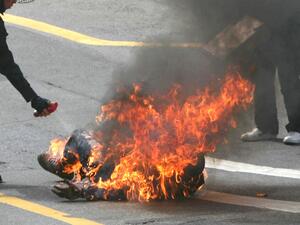 A man on fire, endless pain.