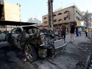 حطام سيارة انفجرت في وسط بغداد
