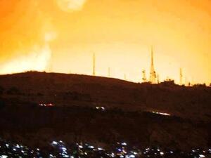 Damascus sky lights up following the heavy blasts that shook the capital early Sunday. (Al Arabiya)