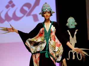 A model presents a creation of Emirati designer Abir al-Suwaidi during Spring/Summer 2011 Dubai Fashion Week in the Gulf emirate.