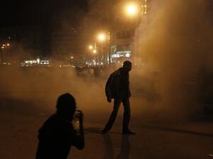 Egyptian protesters walk away after riot police used tear gas during a protest in Tahrir Square on January 24, 2012 in Cairo. (Photo: MOHAMMED ABED / AFP)