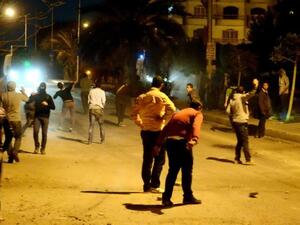 Egyptian protesters clash with riot police in front of the Muslim brotherhood headquarters in Cairo on Sunday. (Photo: AFP / STR)