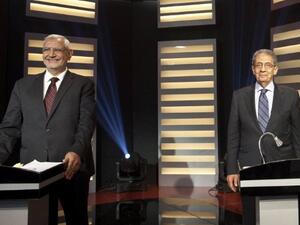 Presidential candidate and former Arab League Secretary General Amr Mussa (R) and moderate Islamist candidate, Abdelmoneim Abul Fotouh, during a live debate in Cairo.