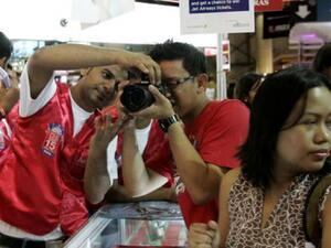 Man uses camera (Gulf News Photo)
