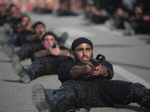 عناصر من قوات امن حماس يشاركون في عرض عسكري
