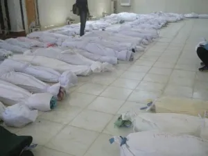 جثث لضحايا سقطوا في المجزرة مسجاة في مسجد في الحولة