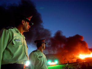 Drug police: Burning drugs in Iran in the attempt to wipe out the drug invasion from neighbor Afghanistan.