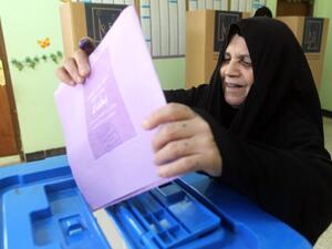 An Iraqi woman casts a ballot at a polling station during provincial elections on April 20, 2013 in Baghdad's Sadr City district. (Photo: AFP PHOTO/AHMAD AL-RUBAYE) 