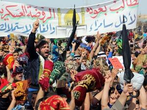 Iraqi protestors shout slogans during a demonstration in the Iraqi city of Samarra in early March demanding the ousting of Prime Minister Nouri al-Maliki. (AFP PHOTO / MAHMOUD AL-SAMARRAI)