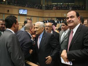 Deputies congratulate Prime Minister Abdullah Ensour after his government won the Parliament's vote of confidence on Tuesday (Photo by Hasan Tamimi)