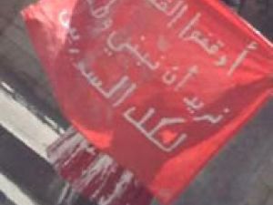 Rima al-Dali is the Syrian Lady in red; protesting with pomp and scarlet