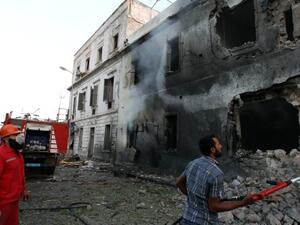 Libyan firefighters extinguish a fire caused by a powerful blast near a foreign ministry building on September 11, 2013 in the eastern Libyan city of Benghazi. (AFP)
