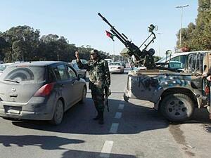 Clashes between Misrata brigade members and security officials at a Tripoli checkpoint left two wounded Tuesday (Ismail Zitouny/Reuters)