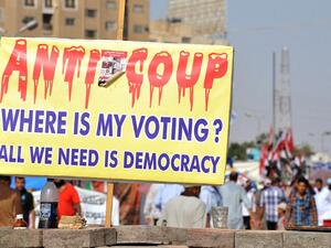 Protestors walk in Cairo on August 2. Egyptian security forces are threatening to blockade a main protest camp.  AFP / FAYEZ NURELDINE