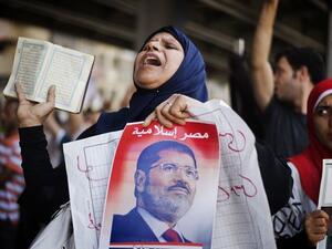 A supporter of the Muslim Brotherhood and Egypt's toppled President Mohamed Morsi shout slogans during a demonstration against the ouster of the former Islamist leader on Aug. 23. (AFP)