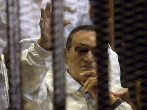 Hosni Mubarak waves to supporters during a court appearance in April (AFP)