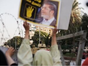  Hundreds of Muslim Brotherhood members and supporters of ousted President Mohammed Morsi, rally outside the Presidential Palace. (Image credit: AFP) 